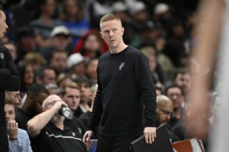 San Antonio Spurs associate coach Sean Sweeney looks on during the second half against the Dallas Mavericks at the American Airlines Center.