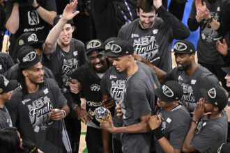 San Antonio Spurs forward Victor Wembanyama (1) celebrates with the MVP trophy after defeating the Oklahoma City Thunder in game seven of the western conference finals for the 2026 NBA playoffs at Paycom Center.