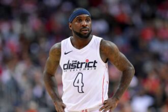 Washington Wizards guard Ty Lawson (4) looks on during the second half of Game 4 of an NBA basketball first-round playoff series against the Toronto Raptors, in Washington. Less than three weeks ago, Lawson was playing professional basketball in China. Nowadays, he's been one of the first subs off the bench for the Washington Wizards in their Eastern Conference first-round playoff series against the No. 1 seed Toronto Raptors (AP Photo/Nick Wass, File)