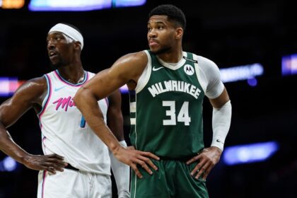 MIAMI, FLORIDA - APRIL 05: Bam Adebayo #13 of the Miami Heat and Giannis Antetokounmpo #34 of the Milwaukee Bucks look on at Kaseya Center on April 05, 2025 in Miami, Florida. (Photo by Brennan Asplen/Getty Images)