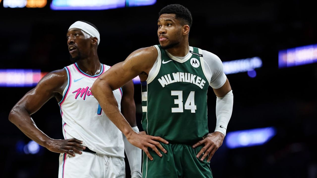 MIAMI, FLORIDA - APRIL 05: Bam Adebayo #13 of the Miami Heat and Giannis Antetokounmpo #34 of the Milwaukee Bucks look on at Kaseya Center on April 05, 2025 in Miami, Florida. (Photo by Brennan Asplen/Getty Images)