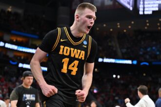 Mar 26, 2026; Houston, TX, USA;Iowa Hawkeyes guard Bennett Stirtz (14) reacts after beating the Nebraska Cornhuskers during a Sweet Sixteen game of the South Regional of the men's 2026 NCAA Tournament at Toyota Center. Mandatory Credit: Maria Lysaker-Imagn Images