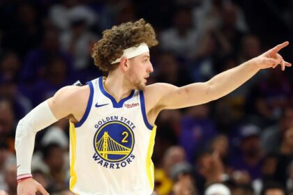 Apr 17, 2026; Phoenix, Arizona, USA; Golden State Warriors guard Brandin Podziemski (2) reacts against the Phoenix Suns during the first half in the play-in rounds of the 2026 NBA Playoffs at Mortgage Matchup Center. Mandatory Credit: Mark J. Rebilas-Imagn Images