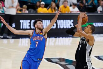 SAN ANTONIO, TX - MAY 22: Victor Wembanyama #1 of the San Antonio Spurs shoots over Chet Holmgren #7 of the Oklahoma City Thunder in the fourth quarter of Game Three of the Western Conference Finals NBA Playoffs at Frost Bank Center on May 22, 2026 in San Antonio, Texas. (Photo by Ronald Cortes/Getty Images)