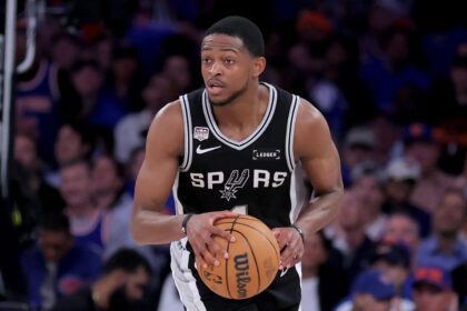 Jun 10, 2026; New York, New York, USA; San Antonio Spurs guard De'aaron Fox (4) controls the ball against the New York Knicks during the fourth quarter of game four of the 2026 NBA Finals at Madison Square Garden. Mandatory Credit: Brad Penner-Imagn Images