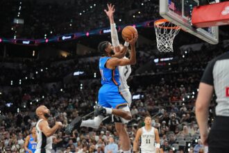 May 24, 2026; San Antonio, Texas, USA; Oklahoma City Thunder guard Isaiah Joe (11) shoots while defended by Oklahoma City Thunder center Chet Holmgren (7) in the fourth quarter during game four of the western conference finals for the 2026 NBA playoffs at Frost Bank Center. Mandatory Credit: Daniel Dunn-Imagn Images