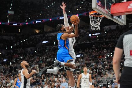 May 24, 2026; San Antonio, Texas, USA; Oklahoma City Thunder guard Isaiah Joe (11) shoots while defended by Oklahoma City Thunder center Chet Holmgren (7) in the fourth quarter during game four of the western conference finals for the 2026 NBA playoffs at Frost Bank Center. Mandatory Credit: Daniel Dunn-Imagn Images