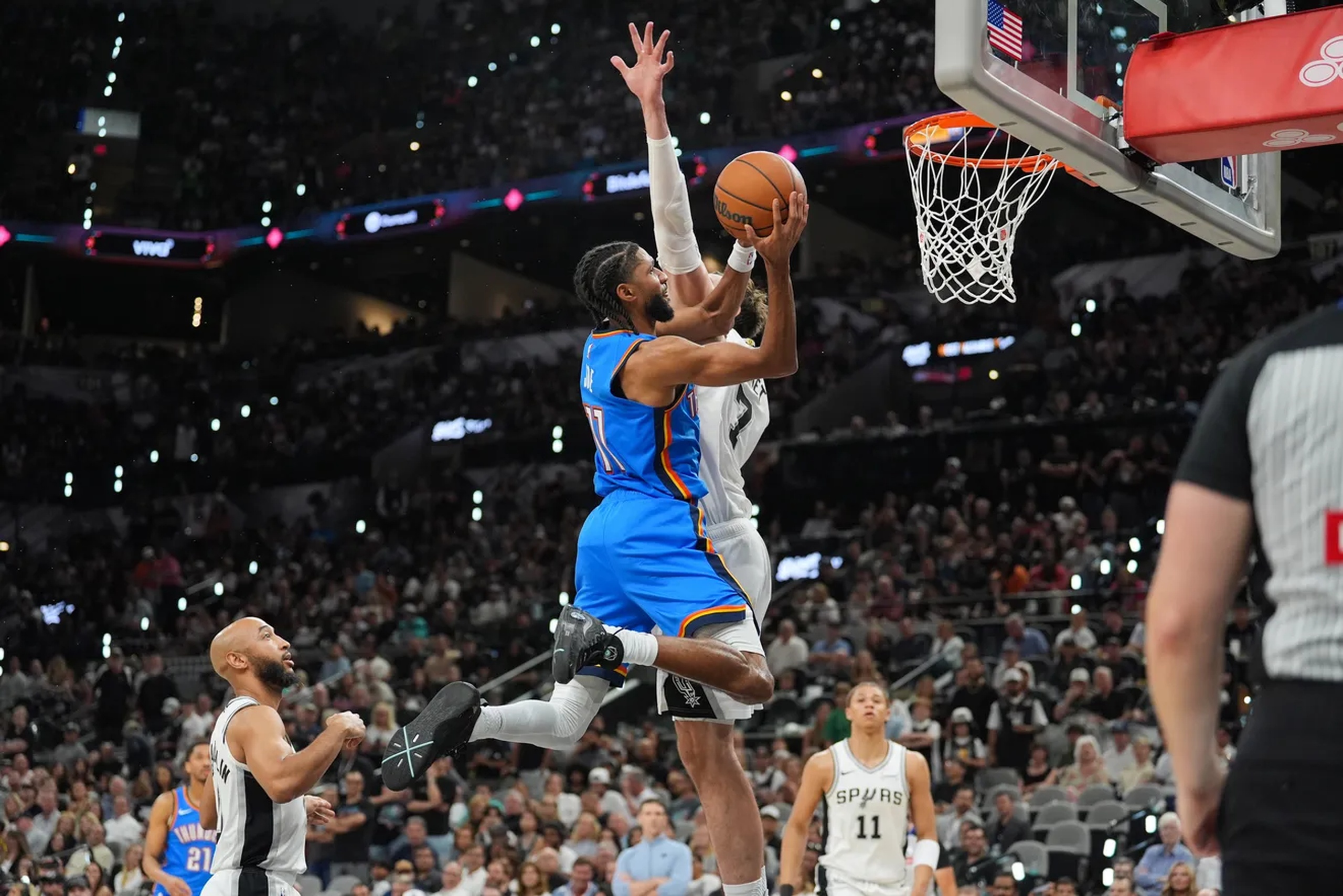 May 24, 2026; San Antonio, Texas, USA; Oklahoma City Thunder guard Isaiah Joe (11) shoots while defended by Oklahoma City Thunder center Chet Holmgren (7) in the fourth quarter during game four of the western conference finals for the 2026 NBA playoffs at Frost Bank Center. Mandatory Credit: Daniel Dunn-Imagn Images