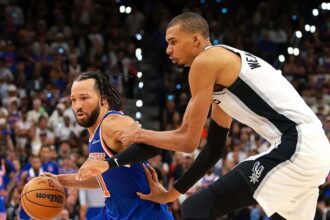 SAN ANTONIO, TEXAS - JUNE 13: Jalen Brunson #11 of the New York Knicks drives to the basket against Victor Wembanyama #1 of the San Antonio Spurs during the fourth quarter in Game Five of the 2026 NBA Finals at Frost Bank Center on June 13, 2026 in San Antonio, Texas. (Photo by Gregory Shamus/Getty Images)