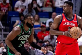 Mar 30, 2024; New Orleans, Louisiana, USA; New Orleans Pelicans forward Zion Williamson (1) looks to pass the ball against Boston Celtics guard Jaylen Brown (7) during the first half at Smoothie King Center. Mandatory Credit: Stephen Lew-Imagn Images