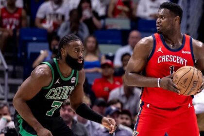 Mar 30, 2024; New Orleans, Louisiana, USA; New Orleans Pelicans forward Zion Williamson (1) looks to pass the ball against Boston Celtics guard Jaylen Brown (7) during the first half at Smoothie King Center. Mandatory Credit: Stephen Lew-Imagn Images