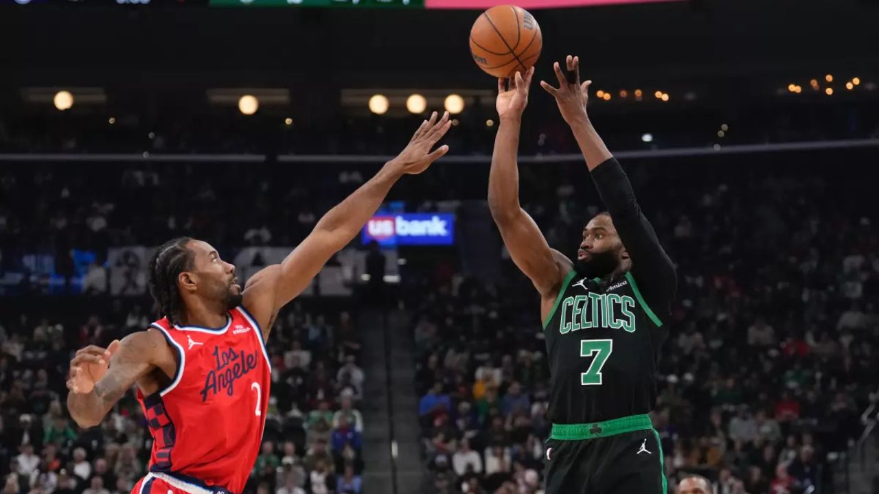 Boston Celtics guard Jaylen Brown shoots over Clippers forward Kawhi Leonard during the first half of the Clippers’ 146-115 loss Saturday night at Intuit Dome. (Mark J. Terrill / Associated Press)