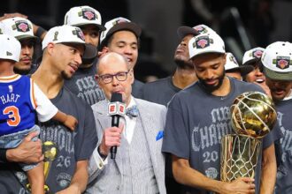 SAN ANTONIO, TEXAS - JUNE 13: Ernie Johnson Jr. interviews Josh Hart #3 and Mikal Bridges #25 of the New York Knicks after the victory against the San Antonio Spurs in Game Five of the 2026 NBA Finals at Frost Bank Center on June 13, 2026 in San Antonio, Texas. (Photo by Gregory Shamus/Getty Images)