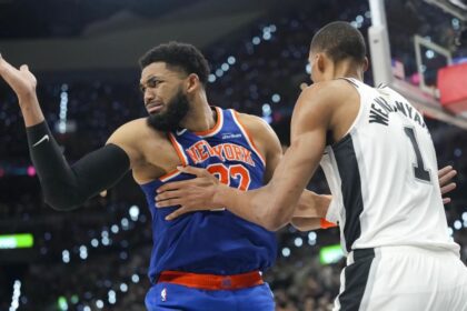 Jun 5, 2026; San Antonio, Texas, USA; New York Knicks center Karl-Anthony Towns (32) and San Antonio Spurs forward Victor Wembanyama (1) battle for position in the fourth quarter during Game 2 of the 2026 NBA Finals at Frost Bank Center. | Scott Wachter-Imagn Images