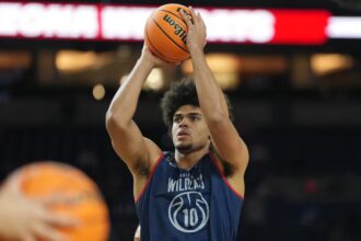 Apr 3, 2026; Indianapolis, IN, USA; Arizona Wildcats forward Koa Peat (10) holds a ball during a practice session ahead of the Final Four of the men's 2026 NCAA Tournament at Lucas Oil Stadium. Mandatory Credit: Robert Deutsch-Imagn Images