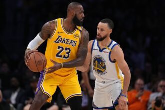 LeBron James #23 of the Los Angeles Lakers controls the ball against Stephen Curry #30 of the Golden State Warriors. (Photo by Michael Owens/Getty Images)