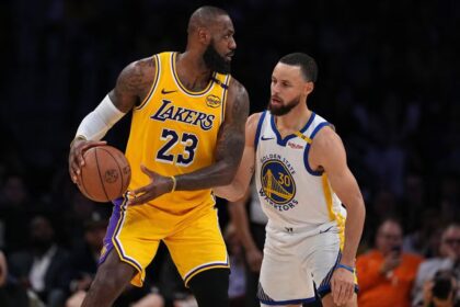LeBron James #23 of the Los Angeles Lakers controls the ball against Stephen Curry #30 of the Golden State Warriors. (Photo by Michael Owens/Getty Images)