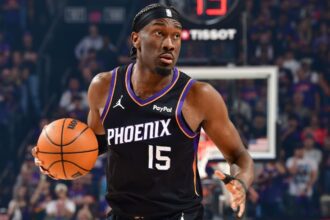 PHOENIX, AZ - APRIL 14: Mark Williams #15 of the Phoenix Suns looks to pass the ball during the game against the Portland Trail Blazers during the 2026 SoFi Play-In Tournament on April 14, 2026 at PHX Arena in Phoenix, Arizona. (Photo by Barry Gossage/NBAE via Getty Images)