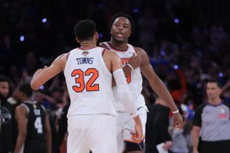 Jun 10, 2026; New York, New York, USA; New York Knicks forward Og Anunoby (8) and center Karl-Anthony Towns (32) react in the fourth quarter against the San Antonio Spurs during game four of the 2026 NBA Finals at Madison Square Garden. Mandatory Credit: Brad Penner-Imagn Images