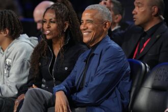 Feb 15, 2026; Inglewood, California, USA; Former first lady Michelle Obama and former President Barack Obama look on before the start of the 75th NBA All Star Game at Intuit Dome. Mandatory Credit: Kirby Lee-Imagn Images