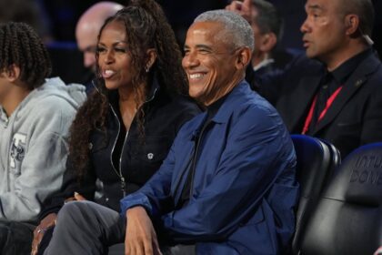 Feb 15, 2026; Inglewood, California, USA; Former first lady Michelle Obama and former President Barack Obama look on before the start of the 75th NBA All Star Game at Intuit Dome. Mandatory Credit: Kirby Lee-Imagn Images