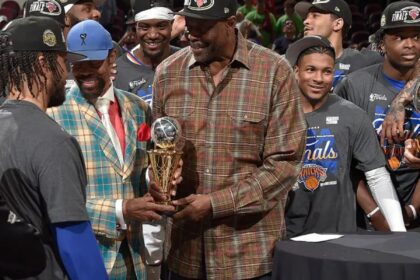 CLEVELAND, OH - MAY 25: Walt Frazier & Patrick Ewing hand Jalen Brunson #11 of the New York Knicks the Larry Bird Trophy after being named the NBA's Eastern Conference Finals Most Valuable Player after Game Four of the 2026 NBA Eastern Conference Finals on May 25, 2026 at Rocket Arena in Cleveland, Ohio. NOTE TO USER: User expressly acknowledges and agrees that, by downloading and/or using this Photograph, user is consenting to the terms and conditions of the Getty Images License Agreement. Mandatory Copyright Notice: Copyright 2026 NBAE (Photo by David Liam Kyle/NBAE via Getty Images)
