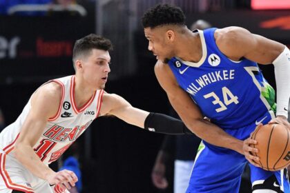 Feb 4, 2023; Milwaukee, Wisconsin, USA; Milwaukee Bucks forward Giannis Antetokounmpo (34) controls the ball against Miami Heat guard Tyler Herro (14) in the second half at Fiserv Forum. Mandatory Credit: Michael McLoone-Imagn Images