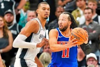 Jun 5, 2026; San Antonio, Texas, USA; New York Knicks guard Jalen Brunson (11) looks to move the ball past San Antonio Spurs forward Victor Wembanyama (1) in the second half during game two of the 2026 NBA Finals at Frost Bank Center. Mandatory Credit: Scott Wachter-Imagn Images