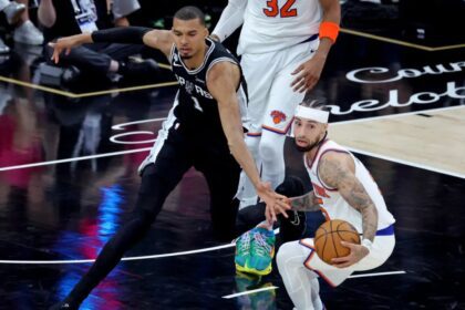 Victor Wembanyama turns the ball over to Jose Alvarado during the second quarter of the Knicks’ Game 1 win over the Spurs. (Image by Charles Wenzelberg / New York Post)