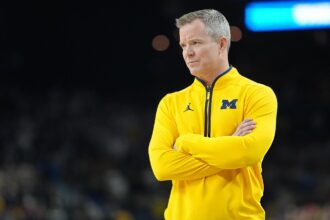 College Basketball: NCAA Finals: Michigan Head Coach Dusty May looks on from the sideline vs UConn at Lucas Oil Stadium. Indianapolis, IN