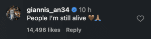 Giannis Antetokounmpo reacts to fans placing mementos.