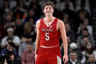 Miami Ohio guard Peter Suder (5) reacts in the second half of an NCAA college basketball game against UMass, Tuesday, Feb. 17, 2026, in Amherst, Mass.