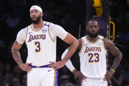 Dec 15, 2024; Los Angeles, California, USA; Los Angeles Lakers forward Anthony Davis (3) and forward LeBron James (23) react in the first half against the Memphis Grizzlies at Crypto.com Arena. Mandatory Credit: Kirby Lee-Imagn Images