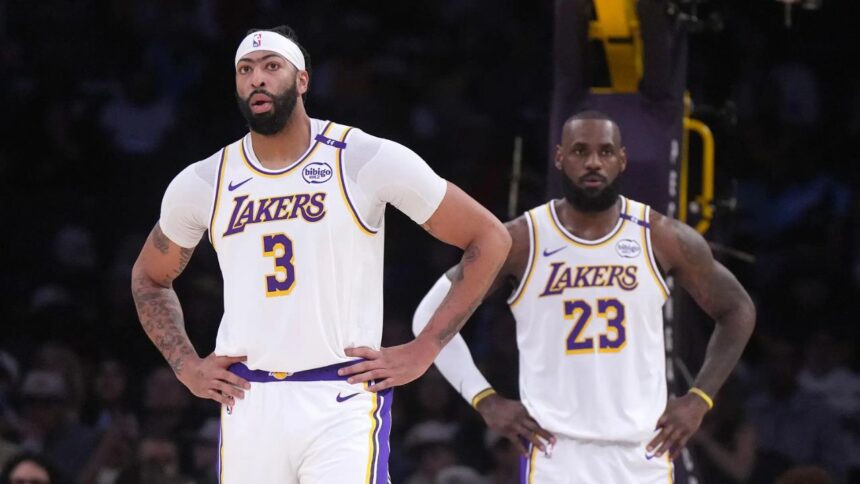 Dec 15, 2024; Los Angeles, California, USA; Los Angeles Lakers forward Anthony Davis (3) and forward LeBron James (23) react in the first half against the Memphis Grizzlies at Crypto.com Arena. Mandatory Credit: Kirby Lee-Imagn Images