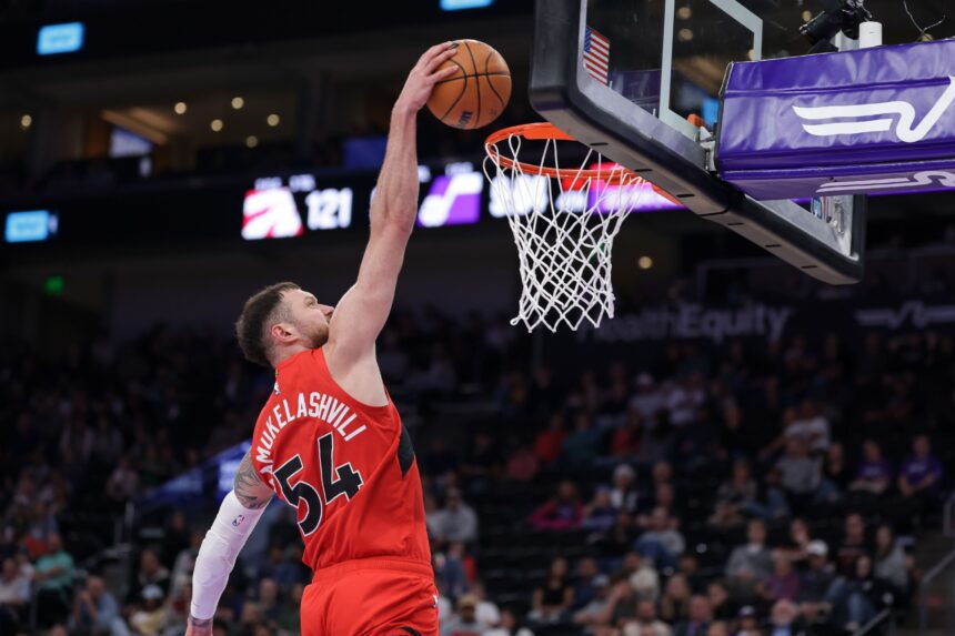 Mar 23, 2026; Salt Lake City, Utah, USA; Toronto Raptors forward/center Sandro Mamukelashvili (54) dunks the ball during the second half against the Utah Jazz at Delta Center. Mandatory Credit: Chris Nicoll-Imagn Images