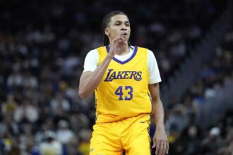 Lakers rookie Cameron Carr celebrates after making a three-pointer against Golden State in an NBA summer league game on Friday night.