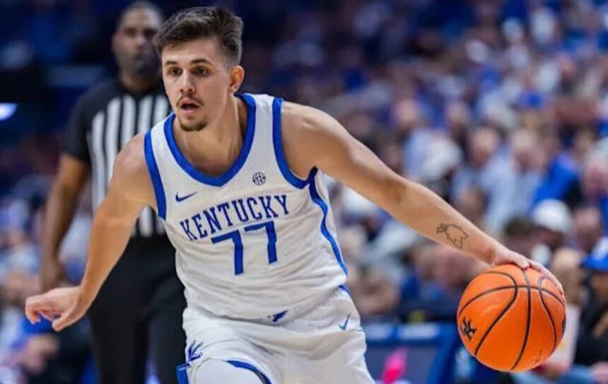 Kerr Kriisa #77 of the Kentucky Wildcats brings the ball up court during the game against the Wright State Raiders at Rupp Arena on November 4, 2024, in Lexington, Kentucky.